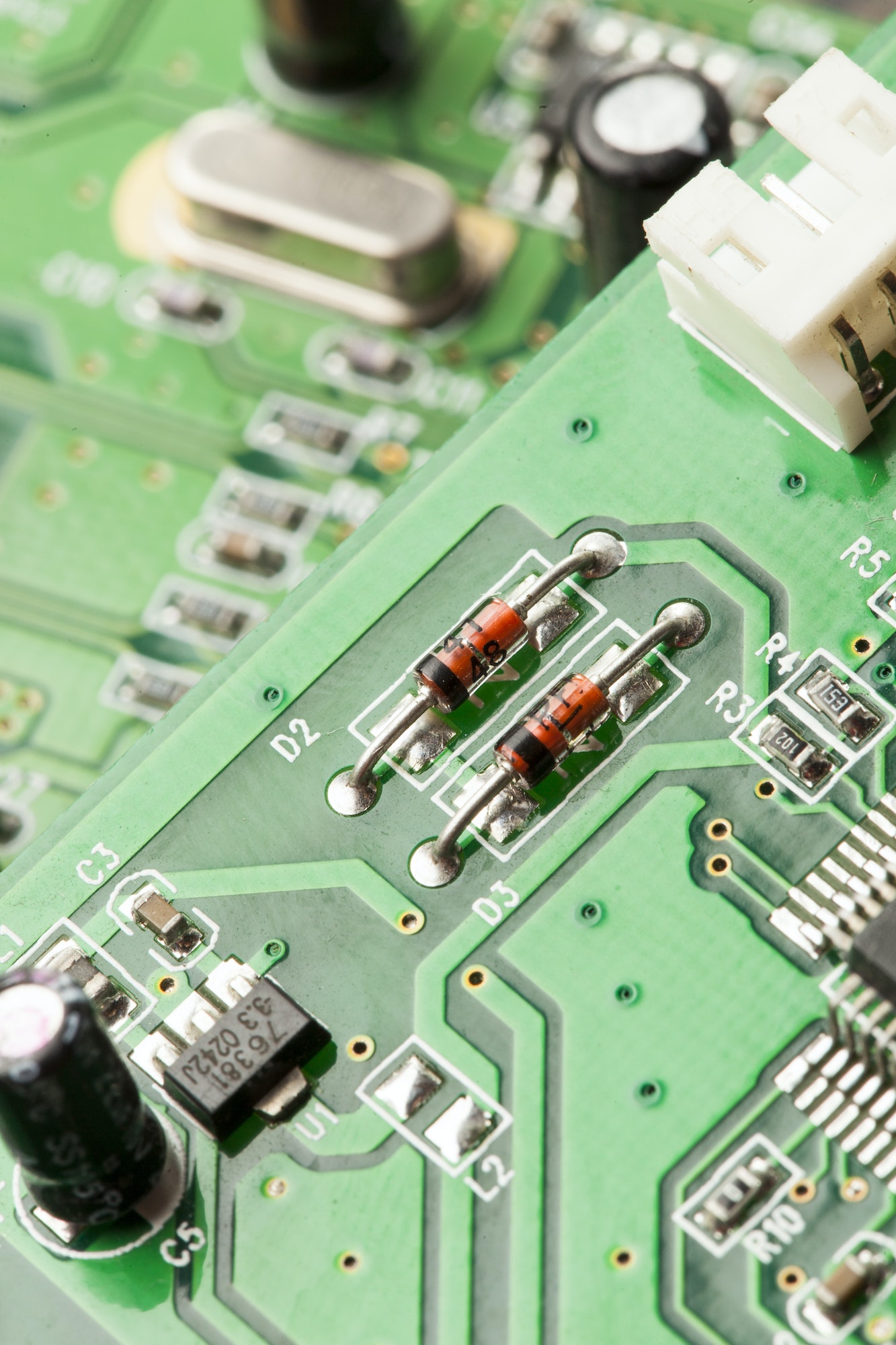 Green Electrical Circuit Board with microchips and transistors